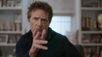 Movie still from “Still: A Michael J. Fox Movie” (2023), directed by Davis Guggenheim – A person sitting in a chair; Close Up shot, Over the shoulder angle