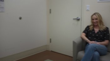 Movie still from “Still: A Michael J. Fox Movie” (2023), directed by Davis Guggenheim – A woman sitting in a chair in front of an open door; Wide shot, Over the shoulder angle