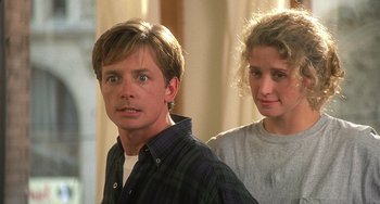 Movie still from “Still: A Michael J. Fox Movie” (2023), directed by Davis Guggenheim – A man and a woman standing next to each other; Close Up shot, Low angle