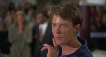 Movie still from “Still: A Michael J. Fox Movie” (2023), directed by Davis Guggenheim – A young man with blue eyes is looking to his left; Close Up shot, Low angle