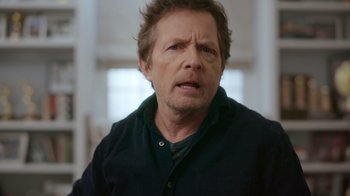 Movie still from “Still: A Michael J. Fox Movie” (2023), directed by Davis Guggenheim – A person wearing a black shirt; Close Up shot, Over the shoulder angle