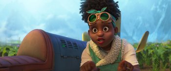 Movie still from “Strange World” (2022), directed by Don Hall – A little girl that is standing up in a room; Close Up shot, Over the shoulder angle