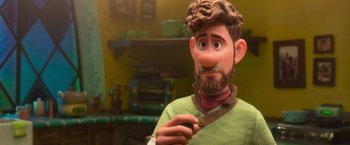 Movie still from “Strange World” (2022), directed by Don Hall – A man with a beard is holding a cell phone; Close Up shot, Over the shoulder angle