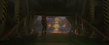 Movie still from “Strange World” (2022), directed by Don Hall – A man with a backpack standing in front of a building; Wide shot, Low angle