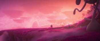 Movie still from “Strange World” (2022), directed by Don Hall – A person standing in a field with a tree in the background; Extreme Wide shot, Over the shoulder angle