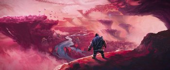 Movie still from “Strange World” (2022), directed by Don Hall – A man standing on top of a hill; Extreme Wide shot, Overhead angle