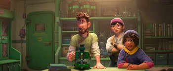 Movie still from “Strange World” (2022), directed by Don Hall – A man and a woman are looking at something on the table; Medium shot, Over the shoulder angle