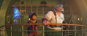 Movie still from “Strange World” (2022), directed by Don Hall – A man standing next to a woman behind a fence; Medium shot, Low angle