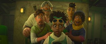 Movie still from “Strange World” (2022), directed by Don Hall – A group of people that are standing around a child; Close Up shot, Low angle