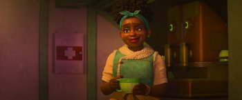 Movie still from “Strange World” (2022), directed by Don Hall – A woman holding a green bowl in her hands; Medium shot, Over the shoulder angle