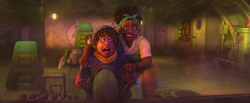 Movie still from “Strange World” (2022), directed by Don Hall – Two animated characters are sitting on a chair in a room; Medium shot, High angle