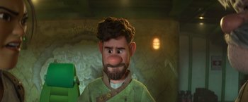 Movie still from “Strange World” (2022), directed by Don Hall – A man with a beard and a green shirt; Close Up shot, Over the shoulder angle