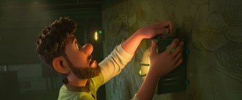 Movie still from “Strange World” (2022), directed by Don Hall – A man is holding something up to his face; Medium shot, Low angle