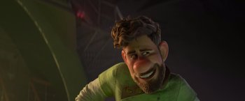 Movie still from “Strange World” (2022), directed by Don Hall – A man with a beard and a green shirt is smiling; Close Up shot, Over the shoulder angle