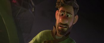 Movie still from “Strange World” (2022), directed by Don Hall – An animated man with a surprised look on his face; Close Up shot, Over the shoulder angle