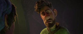Movie still from “Strange World” (2022), directed by Don Hall – An animated man with a beard and a green shirt; Close Up shot, Over the shoulder angle
