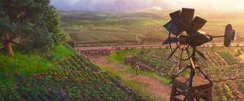 Movie still from “Strange World” (2022), directed by Don Hall – An oil painting of a person standing on a dirt road; Extreme Wide shot, High angle