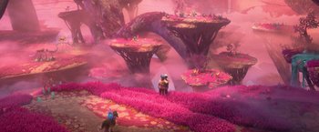 Movie still from “Strange World” (2022), directed by Don Hall – A scene of a pink landscape with a person standing in the middle of it; Extreme Wide shot, High angle