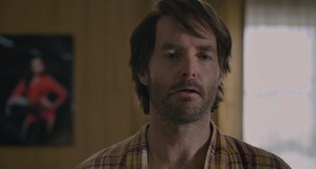 Movie still from “Strays” (2023), directed by Josh Greenbaum – A person wearing a shirt; Close Up shot, Over the shoulder angle