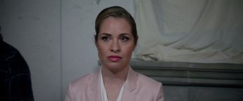 Movie still from “Studio 666” (2022), directed by BJ McDonnell – A person wearing a suit; Close Up shot, Over the shoulder angle