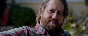 Movie still from “Studio 666” (2022), directed by BJ McDonnell – A person with a beard; Close Up shot, Over the shoulder angle