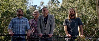 Movie still from “Studio 666” (2022), directed by BJ McDonnell – A group of men standing next to each other; Medium shot, Low angle