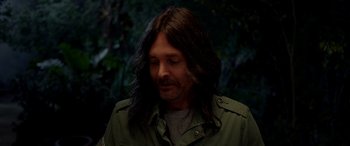 Movie still from “Studio 666” (2022), directed by BJ McDonnell – A person with long brown hair; Close Up shot, Over the shoulder angle