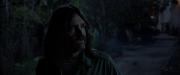 Movie still from “Studio 666” (2022), directed by BJ McDonnell – A person with long brown hair; Close Up shot, Over the shoulder angle