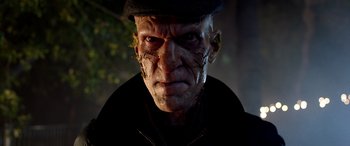 Movie still from “Studio 666” (2022), directed by BJ McDonnell – An old man wearing a hat and looking angry; Close Up shot, Low angle