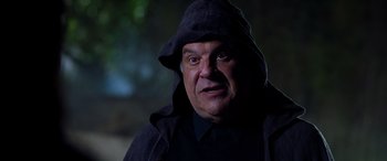 Movie still from “Studio 666” (2022), directed by BJ McDonnell – A person wearing a hooded jacket; Close Up shot, Low angle