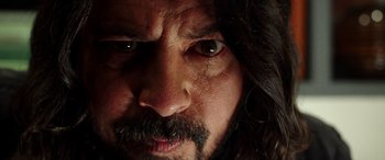 Movie still from “Studio 666” (2022), directed by BJ McDonnell – A person with long hair; Extreme Close Up shot, Low angle