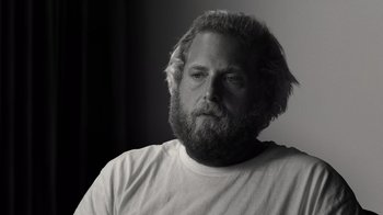 Movie still from “Stutz” (2022), directed by Jonah Hill – Black and white photograph of a man with a beard; Close Up shot, Low angle