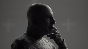 Movie still from “Stutz” (2022), directed by Jonah Hill – A man with bald head is looking to his left; Close Up shot, Low angle