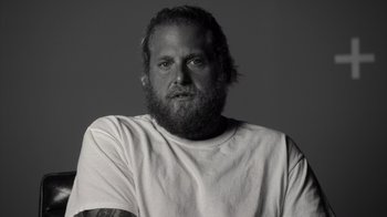 Movie still from “Stutz” (2022), directed by Jonah Hill – Black and white photograph of a man with a beard; Close Up shot, Low angle