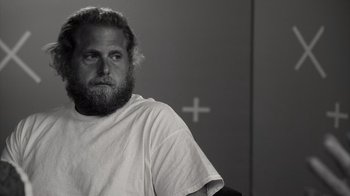 Movie still from “Stutz” (2022), directed by Jonah Hill – Black and white photograph of a man with a beard; Close Up shot, Over the shoulder angle