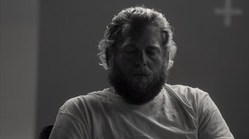 Movie still from “Stutz” (2022), directed by Jonah Hill – Black and white photograph of a man with a beard; Close Up shot, Low angle