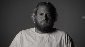 Movie still from “Stutz” (2022), directed by Jonah Hill – Black and white photograph of a man with a beard; Close Up shot, Low angle
