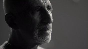 Movie still from “Stutz” (2022), directed by Jonah Hill – An old man with a beard is looking into the distance; Close Up shot, Low angle