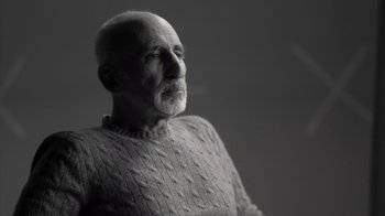 Movie still from “Stutz” (2022), directed by Jonah Hill – An older man wearing a sweater looking to his left; Close Up shot, Low angle
