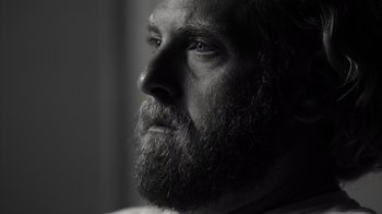 Movie still from “Stutz” (2022), directed by Jonah Hill – Black and white photograph of a man with a long beard; Close Up shot, Low angle