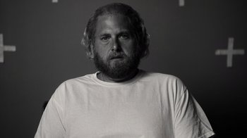 Movie still from “Stutz” (2022), directed by Jonah Hill – Black and white photograph of a man with a beard; Close Up shot, Low angle