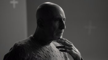 Movie still from “Stutz” (2022), directed by Jonah Hill – An older man with a bald head is looking at the camera; Close Up shot, Low angle