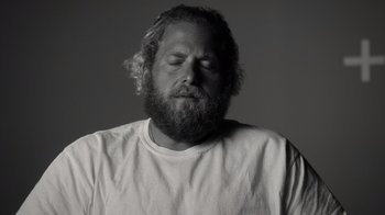 Movie still from “Stutz” (2022), directed by Jonah Hill – Black and white photograph of a man with a beard; Close Up shot, Low angle