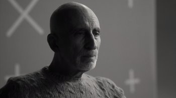 Movie still from “Stutz” (2022), directed by Jonah Hill – An older man with a bald head wearing a sweater; Close Up shot, Low angle