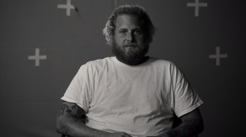 Movie still from “Stutz” (2022), directed by Jonah Hill – Black and white photograph of a man with a beard; Close Up shot, Low angle