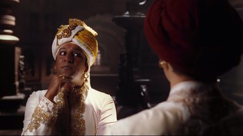 Movie still from “Charlie and the Chocolate Factory” (2005), directed by Tim Burton – A man wearing a turban looking in the mirror; Medium shot, Over the shoulder angle
