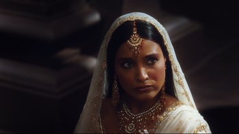 Movie still from “Charlie and the Chocolate Factory” (2005), directed by Tim Burton – A woman in a white dress and a white veil; Close Up shot, Over the shoulder angle