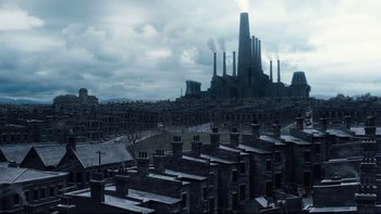 Movie still from “Charlie and the Chocolate Factory” (2005), directed by Tim Burton – An image of a city with a lot of smoke coming out of the chimney; Extreme Wide shot, High angle