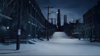 Movie still from “Charlie and the Chocolate Factory” (2005), directed by Tim Burton – A snowy street with a street light on top of it; Extreme Wide shot, High angle