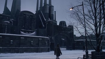 Movie still from “Charlie and the Chocolate Factory” (2005), directed by Tim Burton – A person standing in front of a building in the snow; Extreme Wide shot, Low angle